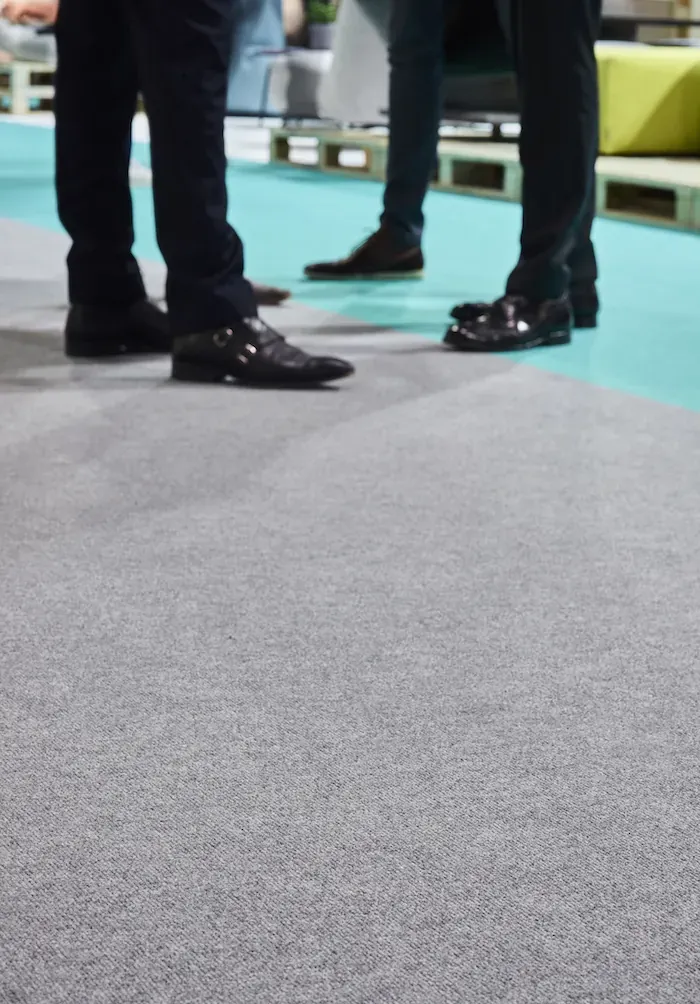 Carpet Basalt, mid-grey loop pile on a trade show floor