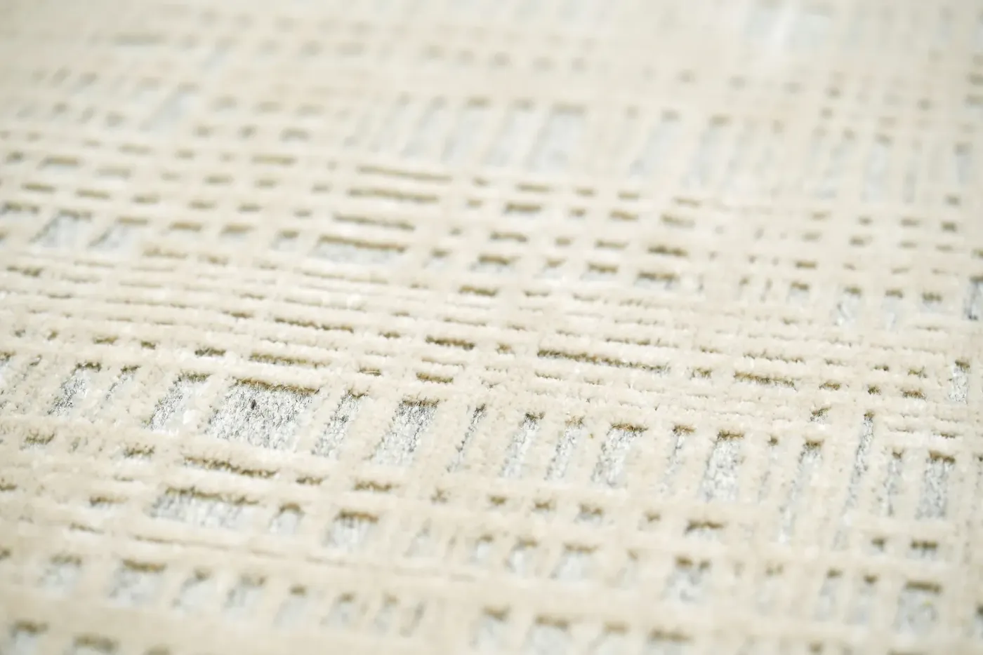 Custom rug Almond, ivory embossed geometric weave in close-up