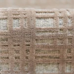 Custom rug Bistre, close-up of raised ochre diamond pattern