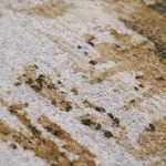Custom rug Tan, marbled loop pile in ivory, ochre and charcoal
