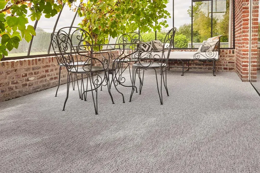 Custom carpet Gravel, light grey weave across a glazed veranda
