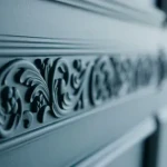 Cornice moulding with carved floral frieze at a mitred corner