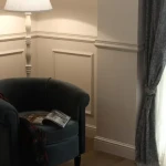 Stepped cornice showing parallel grooves and hollow cable channel