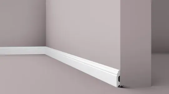 Low skirting board with rounded top edge and cable clip