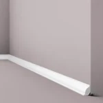 Skirting board with rounded top edge, matt finish at floor level