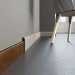 Cable skirting board with clip-on cover and rounded top