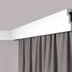 Stepped ceiling cornice with groove for strip lighting