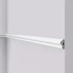 Slim rounded dado moulding along a painted wall