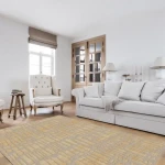 Rug Putty, beige and gold dry-stone block pattern