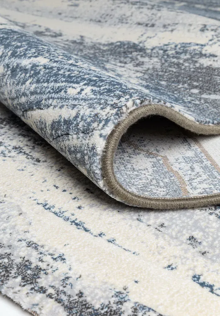 Rug Dawn, folded corner showing pile and beige border