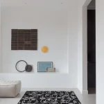 Rug Soft Ash with white line-drawn faces on black