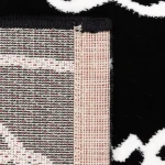 Rug Soft Ash with white line-drawn faces on black