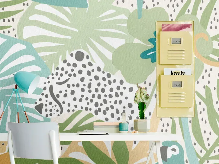 Wall mural Fir, sage and teal leaves behind a desk