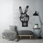 Wall mural Bark, black peace-sign hand on pale brick