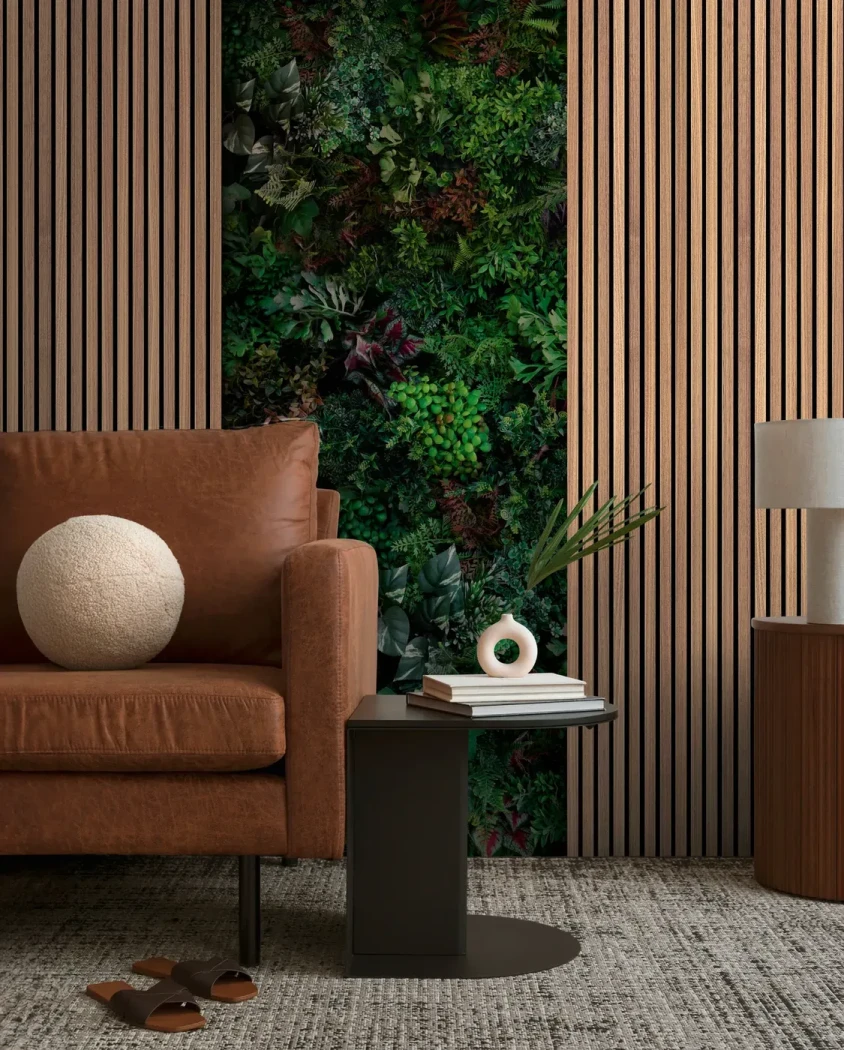 Wall mural Tourmaline, green foliage between pale wood panels