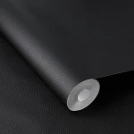 Wallpaper Eclipse in plain matt black with fine leather grain