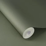 Wallpaper Rosemary in plain green with a fine grain