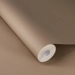 Wallpaper Sienna, plain warm taupe with a grained-leather texture