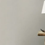 Wallpaper Downpour, plain matt light grey with a fine grain