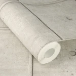 Wallpaper Veiled Straw, beige concrete panels with round formwork holes
