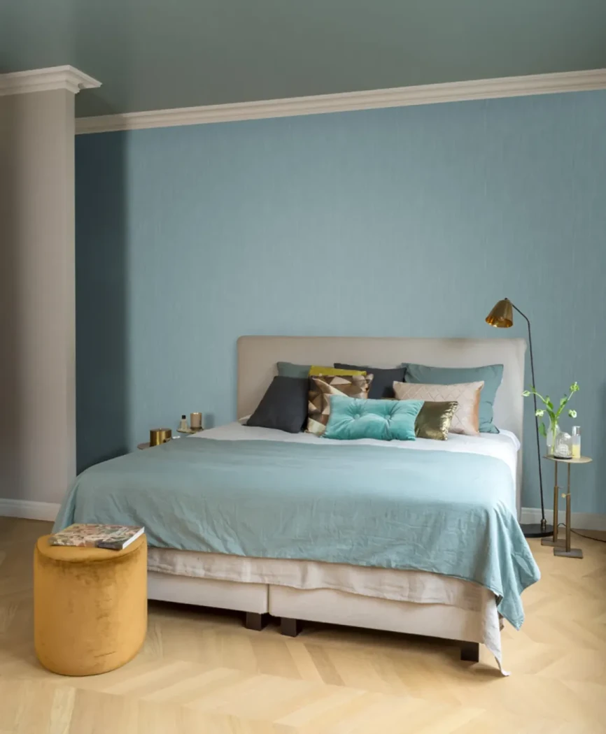 Wallpaper Ocean, plain teal blue wall behind a bed