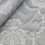 Wallpaper Soft Pewter, silver floral medallions on pearl grey
