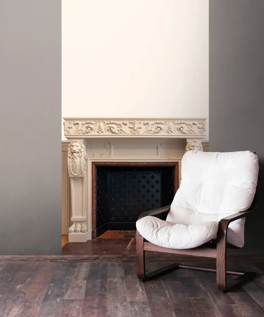 Wallpaper Misty Gravel, plain light grey wall beside a fireplace