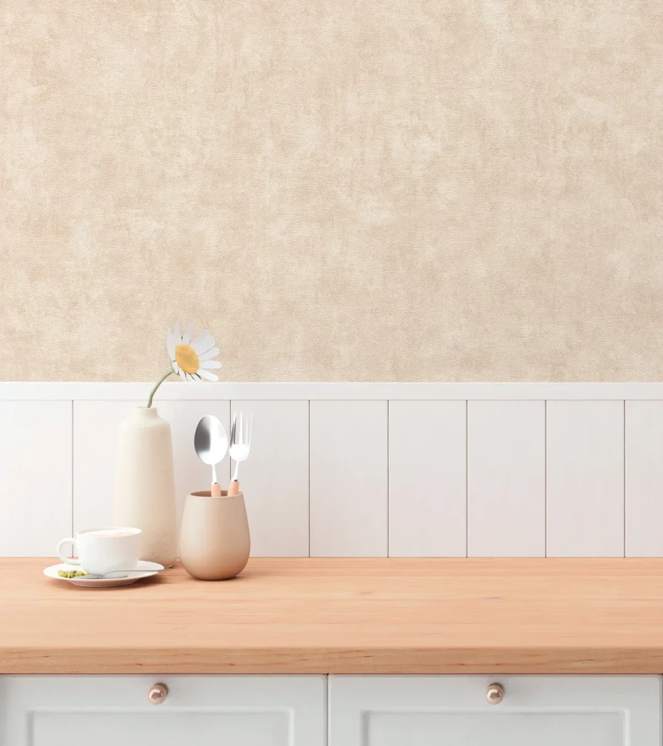 Wallpaper Veiled Oat above white panelling in a kitchen