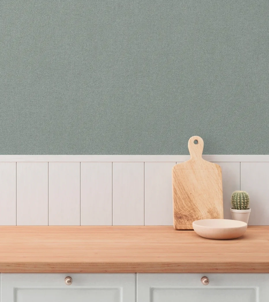 Wallpaper Soft Basalt above white panelling in a kitchen