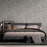 Wallpaper Soft Anthracite, grey stacked-stone effect on a wall