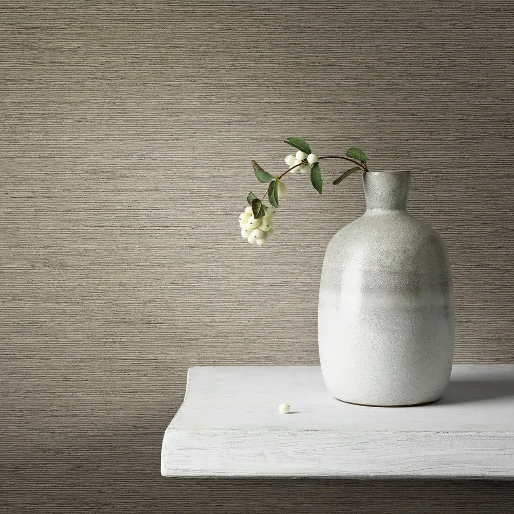 Wall vinyl Yellow Ochre in woven taupe behind light furniture