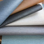Wall vinyl Yellow Ochre in woven taupe behind light furniture